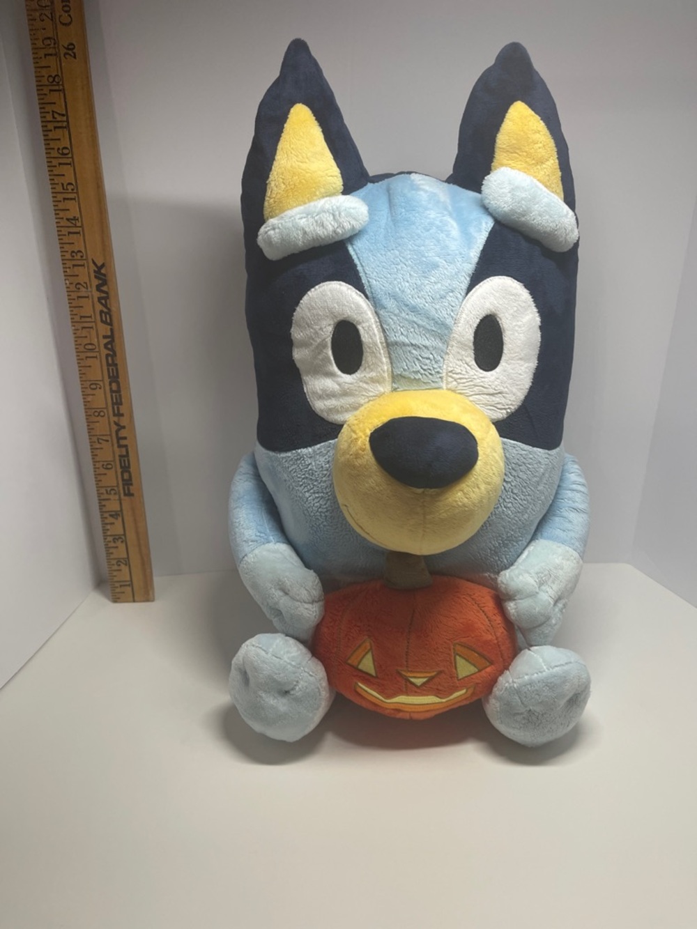 Disney Bluey Light Blue and Navy Plush with Orange Pumpkin